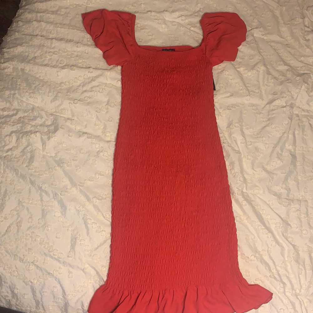 RED SMOCKED OFF THE SHOULDER DRESS.